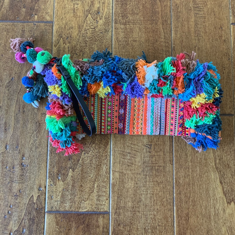 Clutch with tassels.